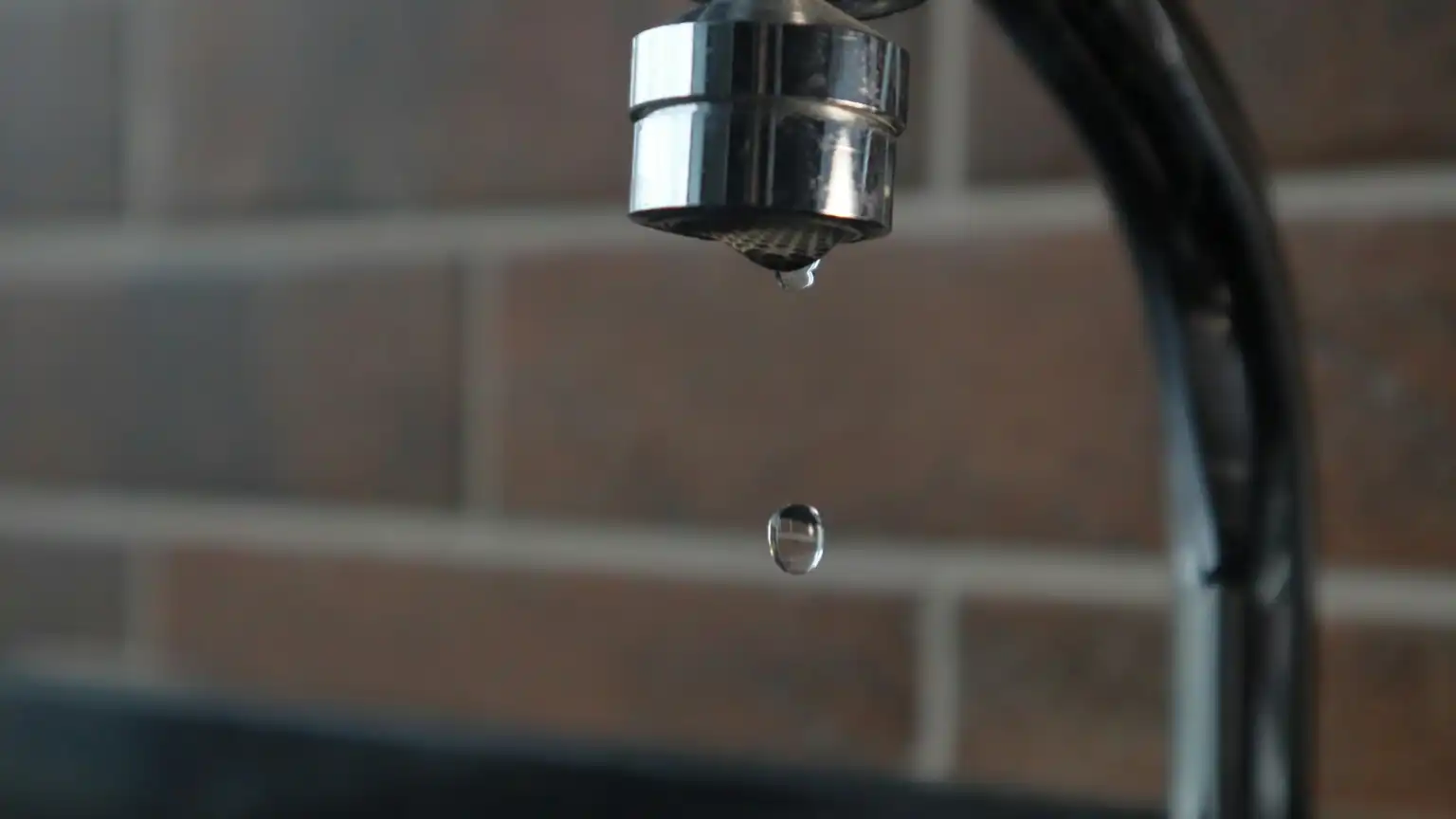 A faucet is leaking.